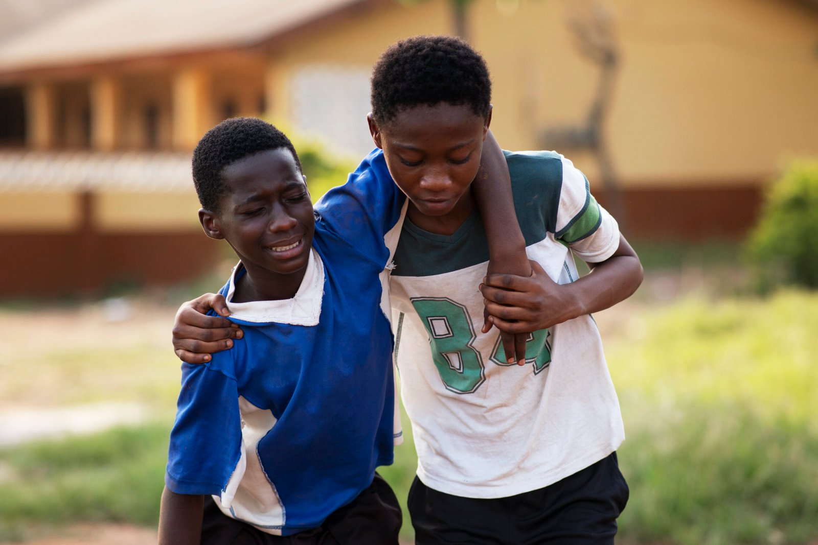 front-view-boy-carrying-crying-friend-2